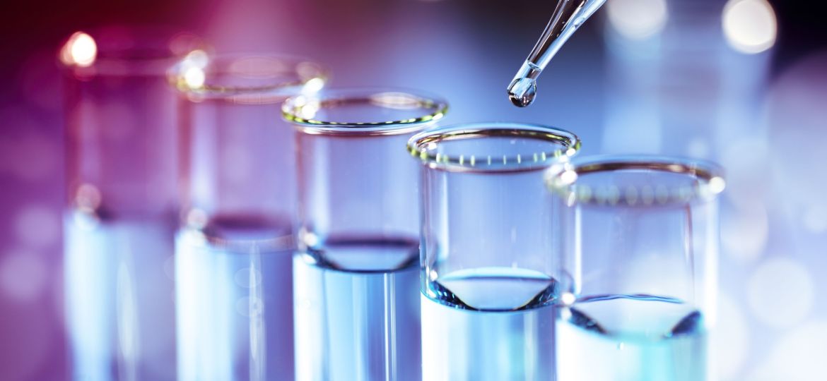 Laboratory test tube glassware with pipette dropper and flask